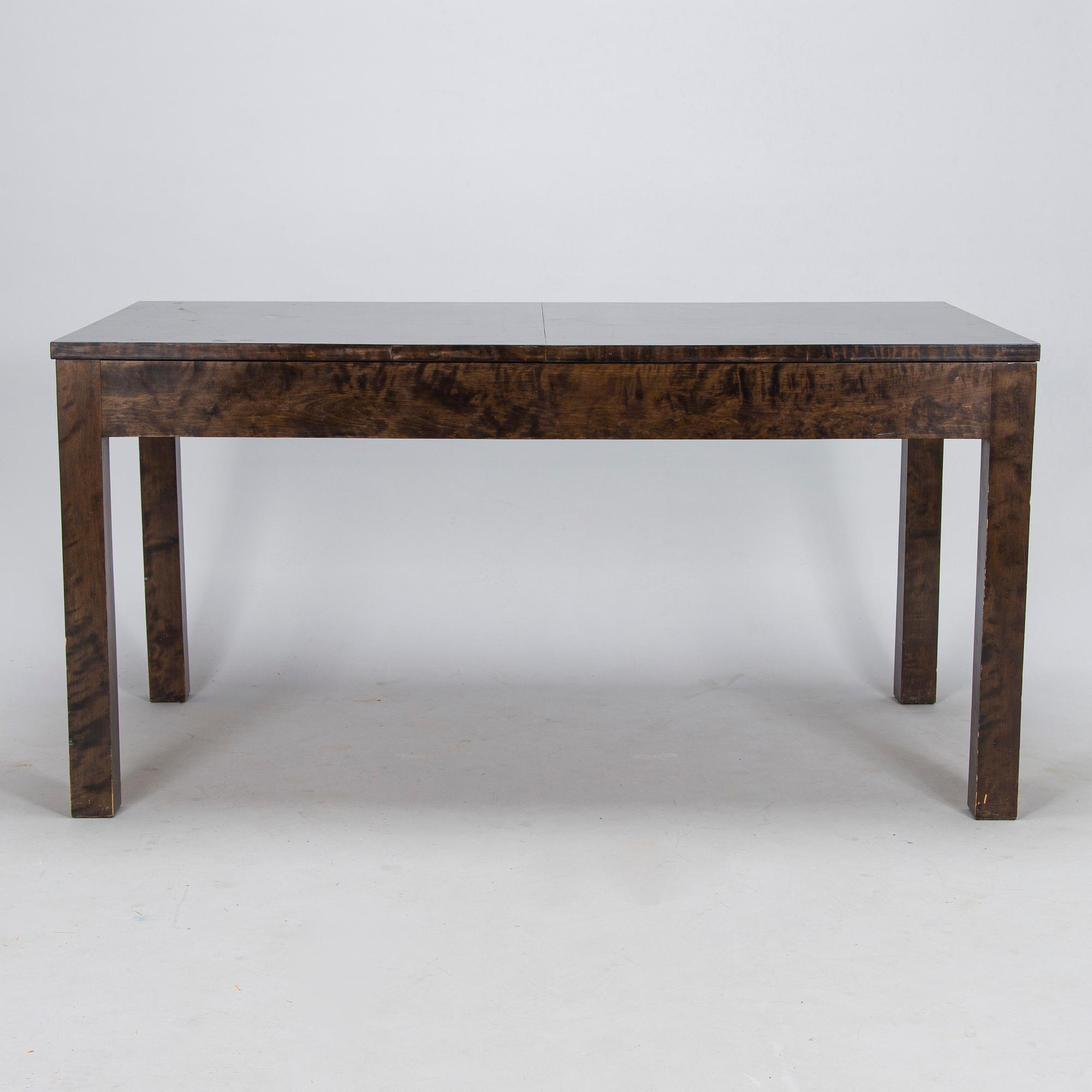 A Finnish 1930s dining table and eight chairs.