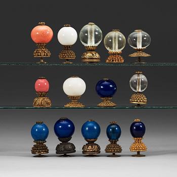 A set of fourteen Mandarin hat buttons, late Qing dynasty (1644-1912).