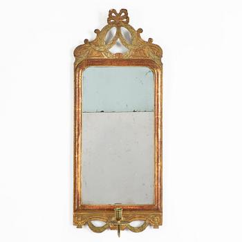 A  Gustavian giltwood one-light girandole mirror by N. Sundström (master in Stockholm 1754-1781).