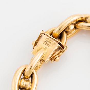 An 18K gold bracelet.