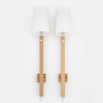 A pair of oak and acrylic wall lights, Luxus, Vittsjö.