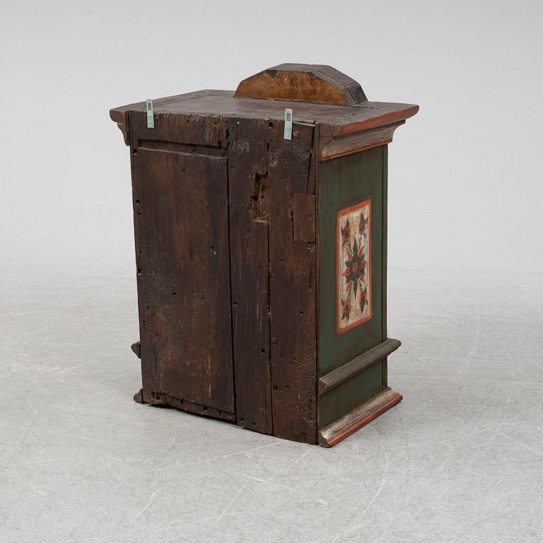 A 18/19th Century painted wall cabinet.