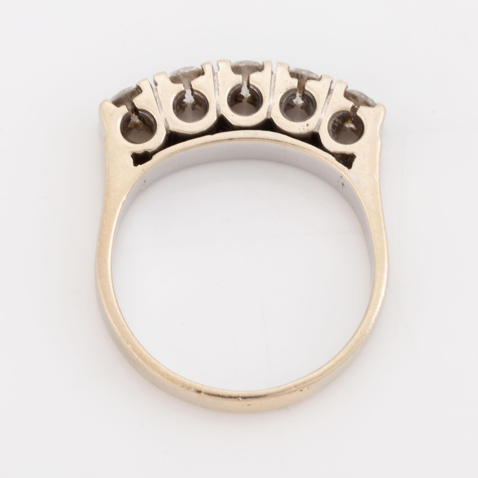 A 14K gold ring set with round brilliant-cut diamonds.