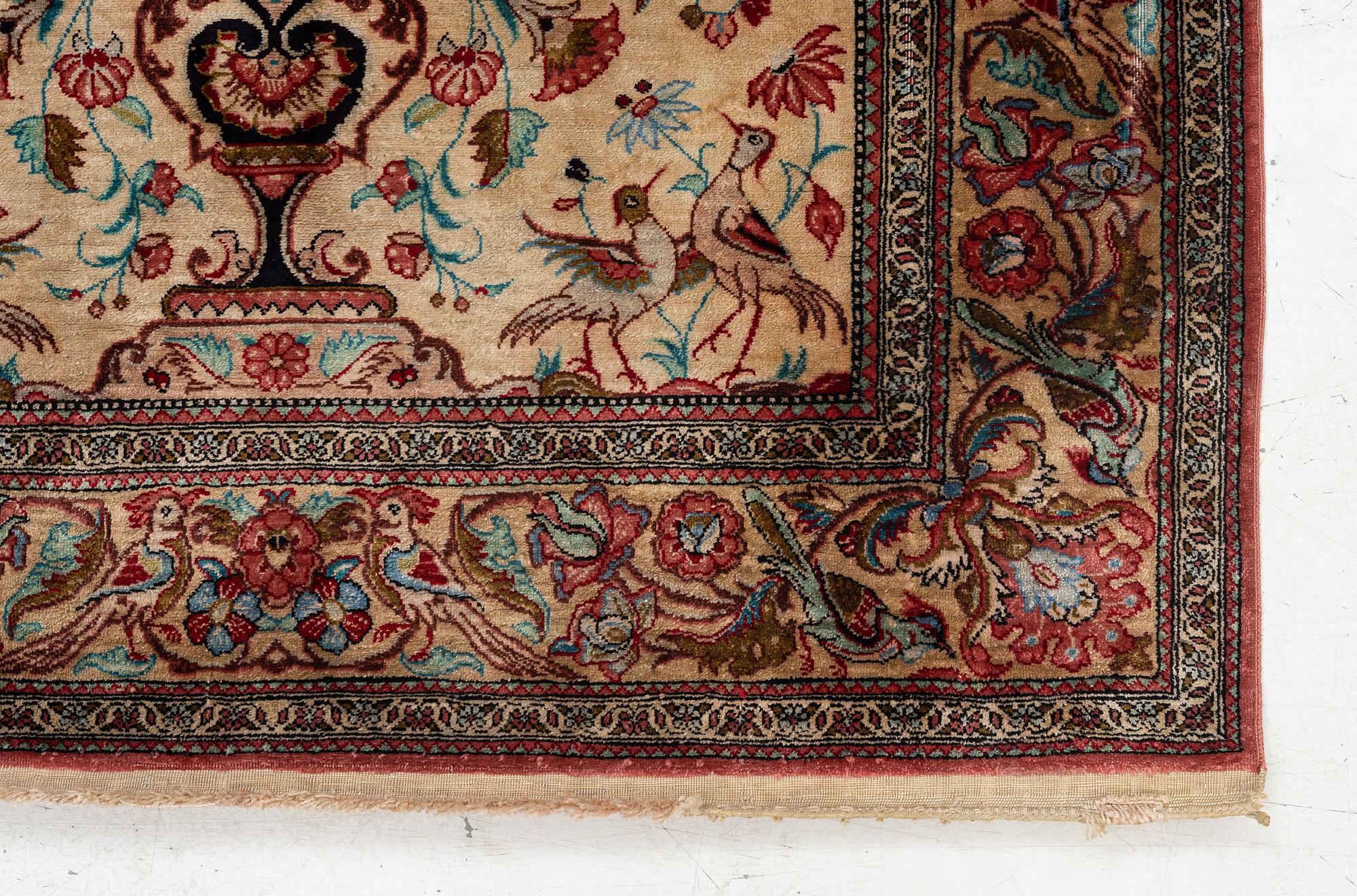 A Qum silk rug, c. 110 x 76 cm.