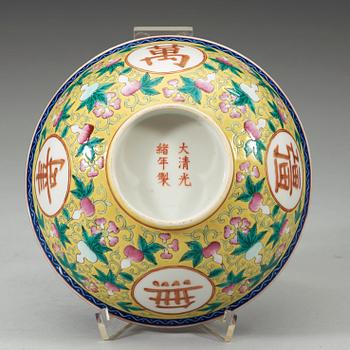A famille rose yellow ground bowl, Qing dynasty, Guangxu six-character mark and of the period  (1875-1908).