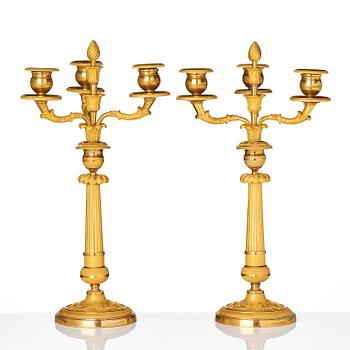 A pair of Empire ormolu three light Candelabra.