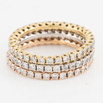 Rings, three pieces, set with brilliant-cut diamonds.