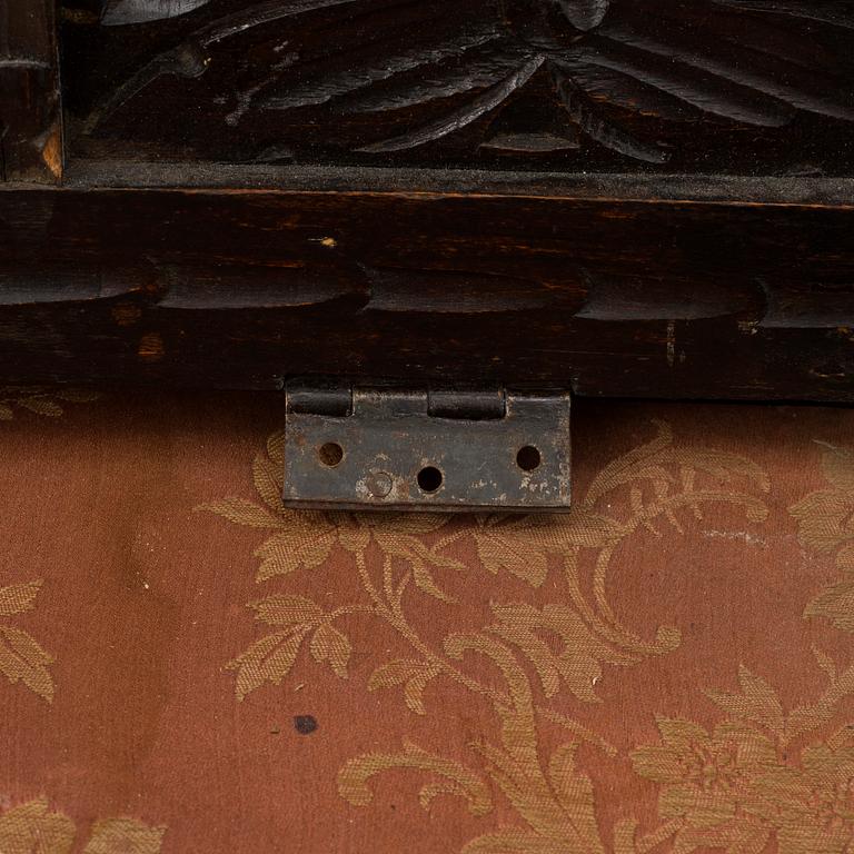 A 19th century baroque style oak chest.