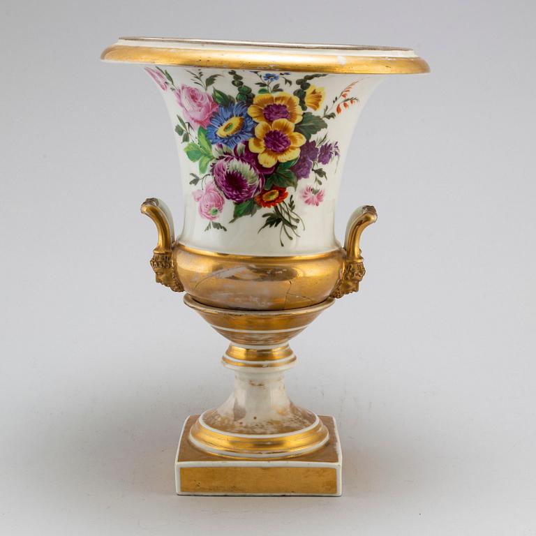 An empire porcelain urn, early 19th century.