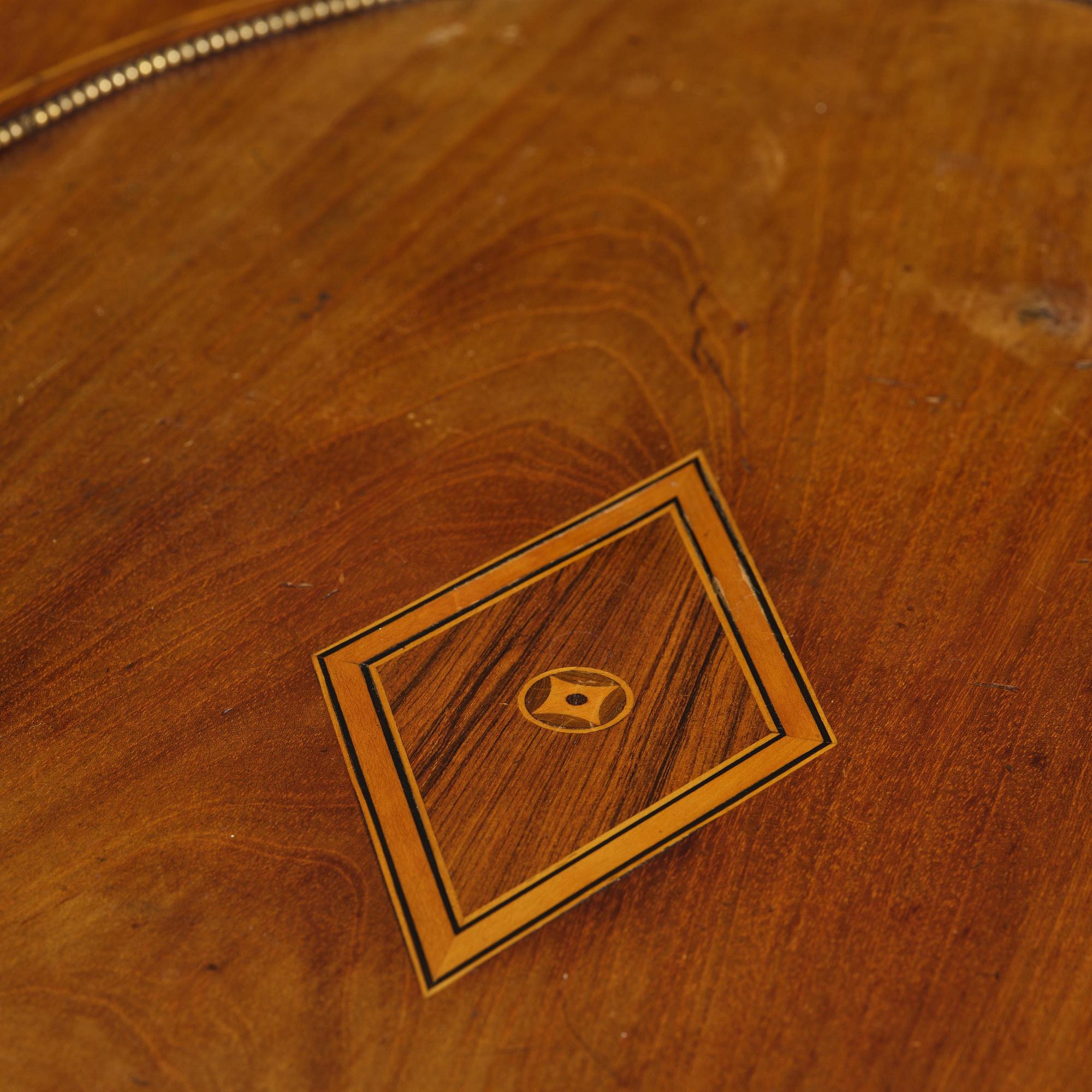 A late Gustavian mahogany parquetry table by L. Qvarnberg '(master in Stockholm 1801-1813).