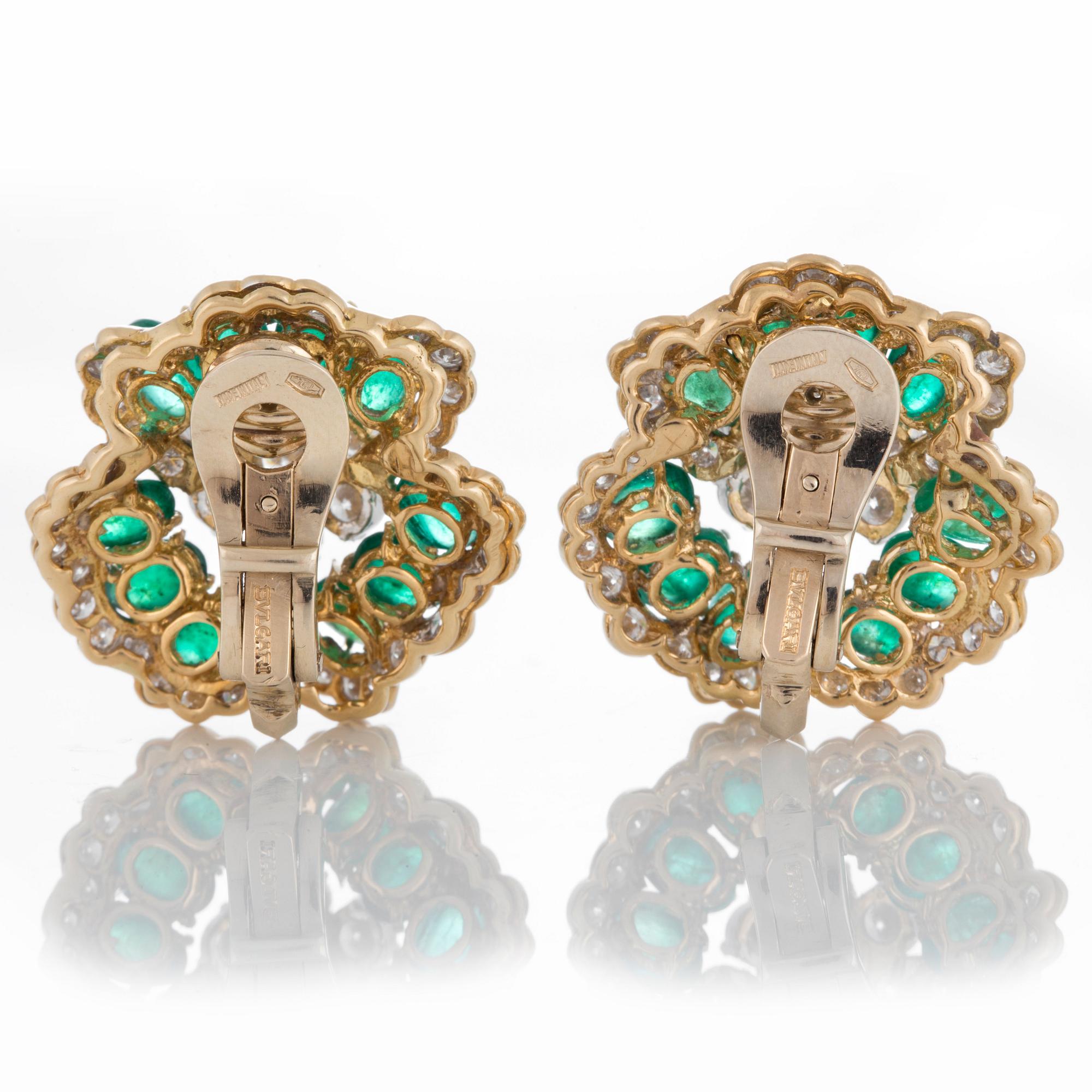 A pair of Bulgari earrings set with cabochon-cut emeralds and round brilliant-cut diamonds.