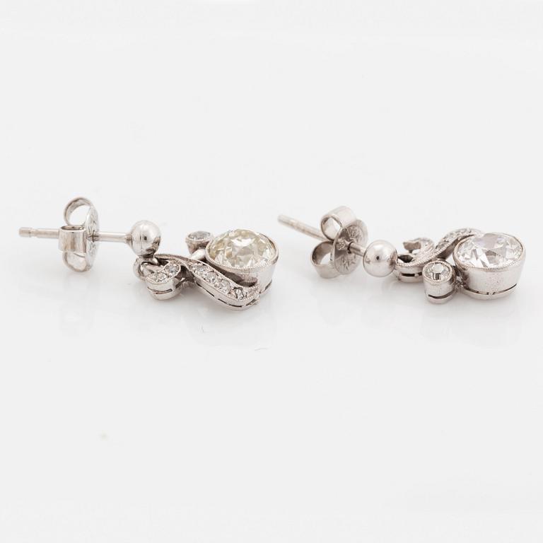 A pair of 18K white gold earrings set with old-cut diamonds.