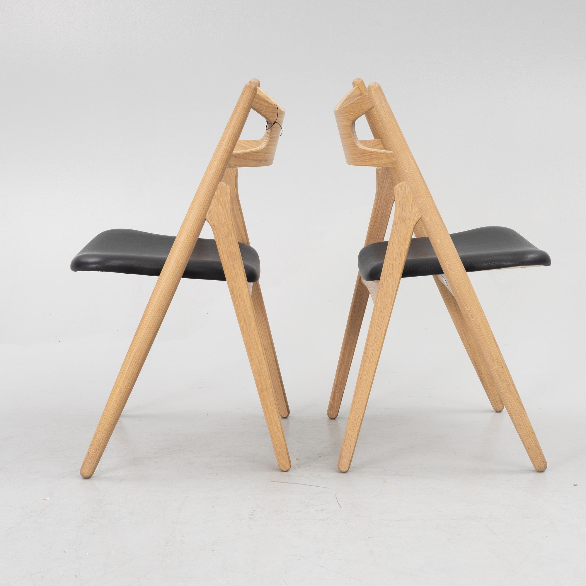Hans J Wegner, a pair of chairs, model CH 29 "The Savbuk Chair", Carl Hansen.