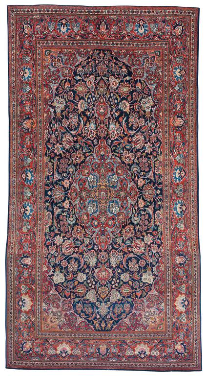 A CARPET. A semi-antique Kashan part silk. 248,5 x 136 cm.