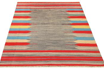 An Afghan Kilim carpet, c. 293 x 199 cm.