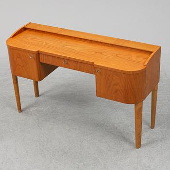A 1940's table with pouf.