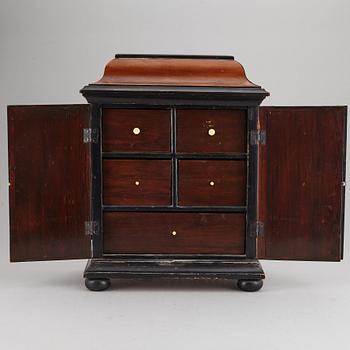 A barocque style spice cabinet, late 19th Century.