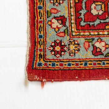 A carpet, semi-antique, Qum, ca 318 x 233 cm.