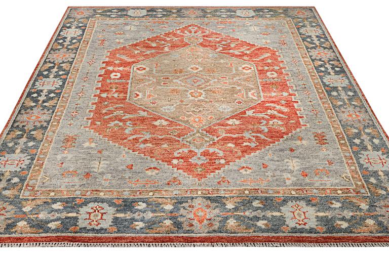 An oriental carpet with Mamluk design, c. 359 x 281 cm.