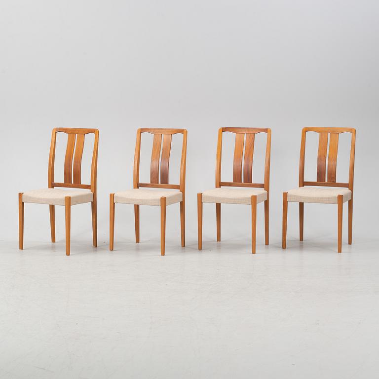 A 'Rimbo' walnut dining table and four chairs, second half of the 20th Century.