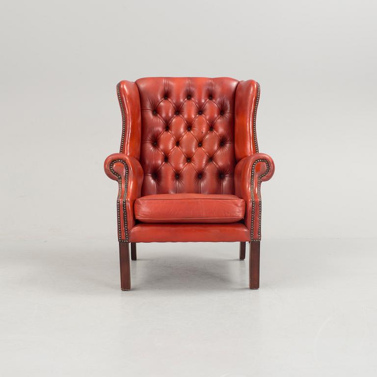 a 20h Century red lether armchair.