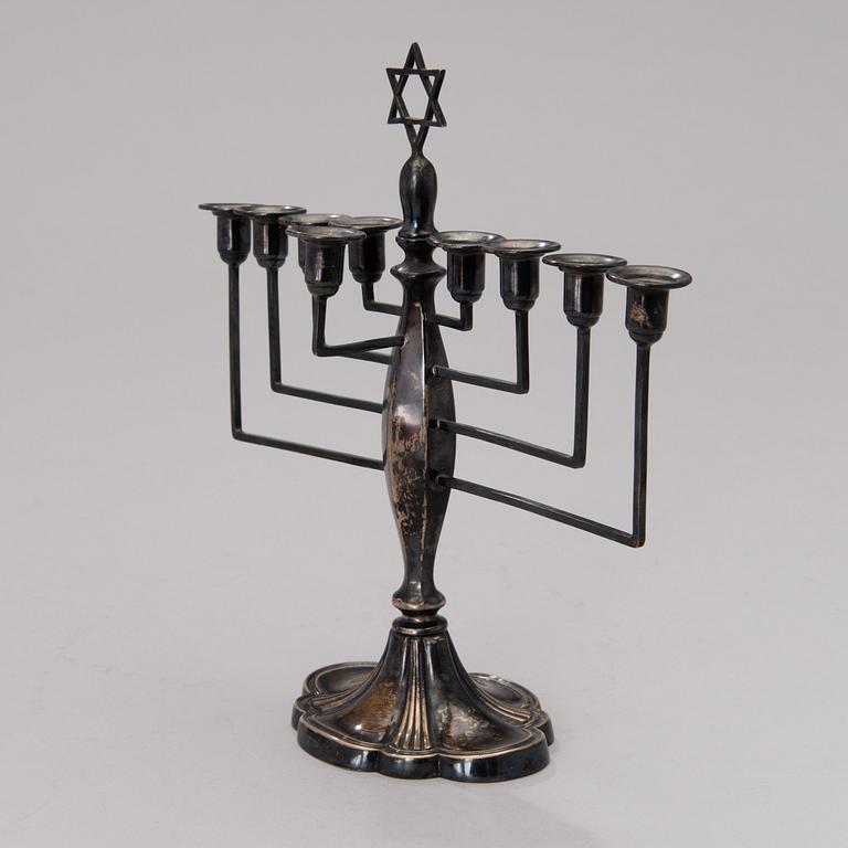 A chanukiah / menorah silver candelabrum for nine candles, mark of Britton, Gould & Co, Birmingham 1933.