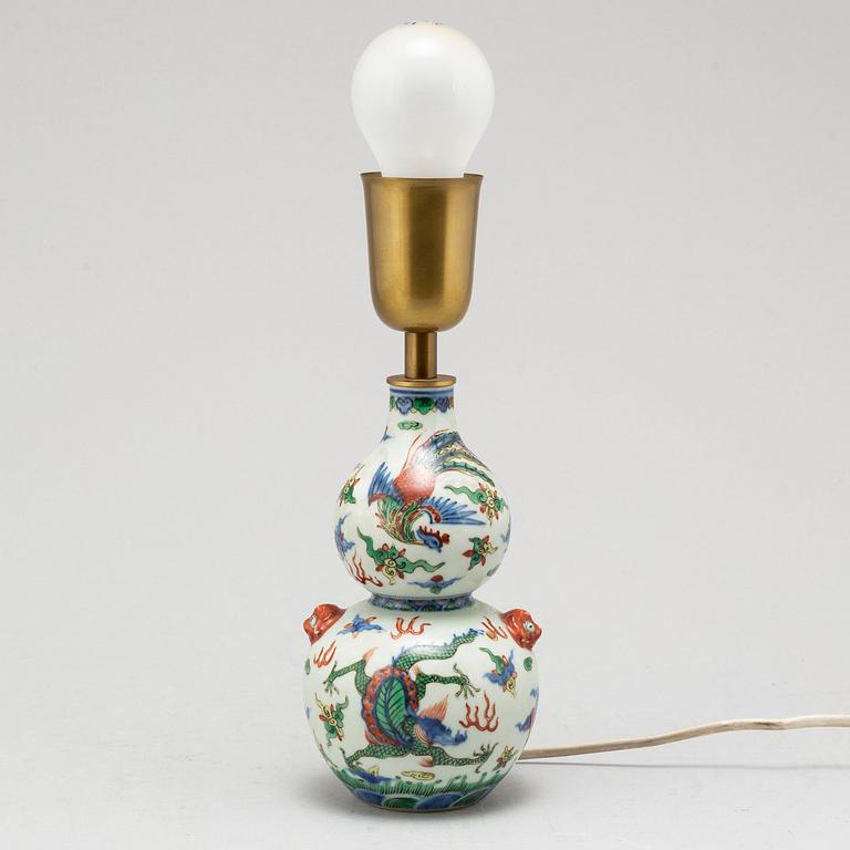 A Chinese porcelain wucai double gourd vase, turned into a table lamp, 20th century.