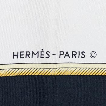 Hermès, a 'Les Voitures à Transformation' silk scarf.