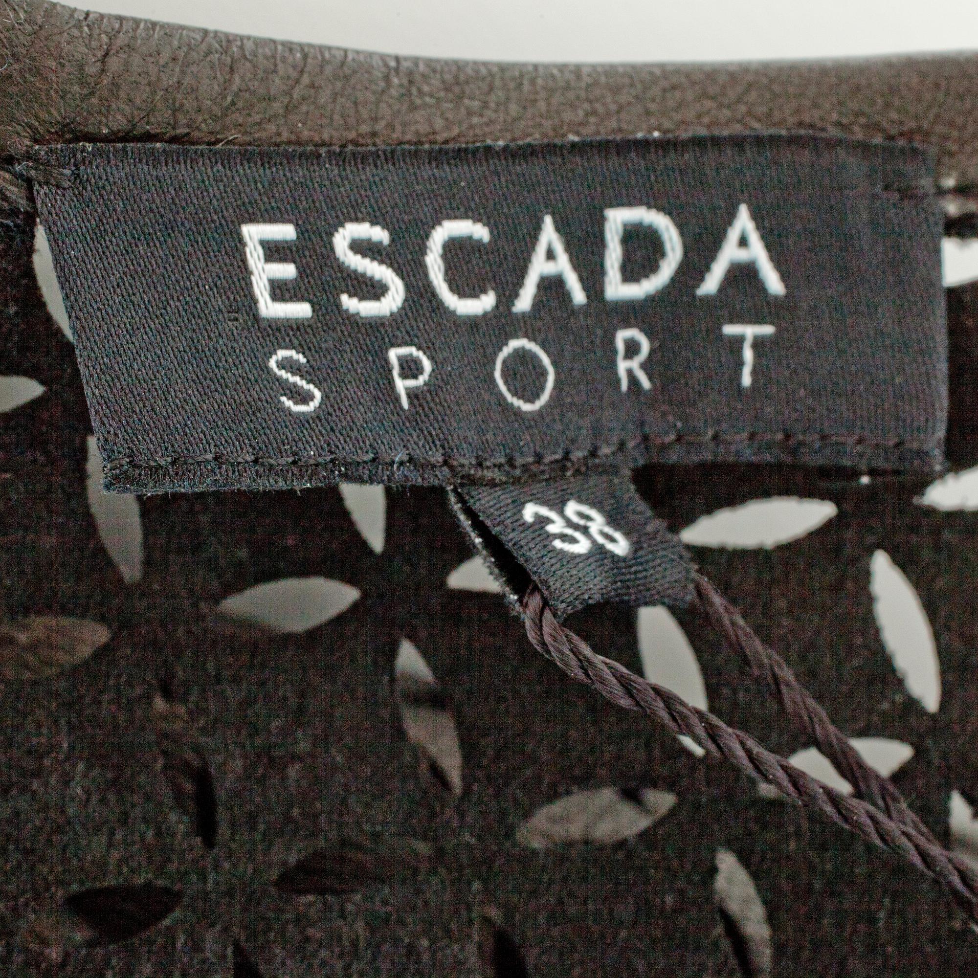 ESCADA SPORT, a black openwork leather dress.