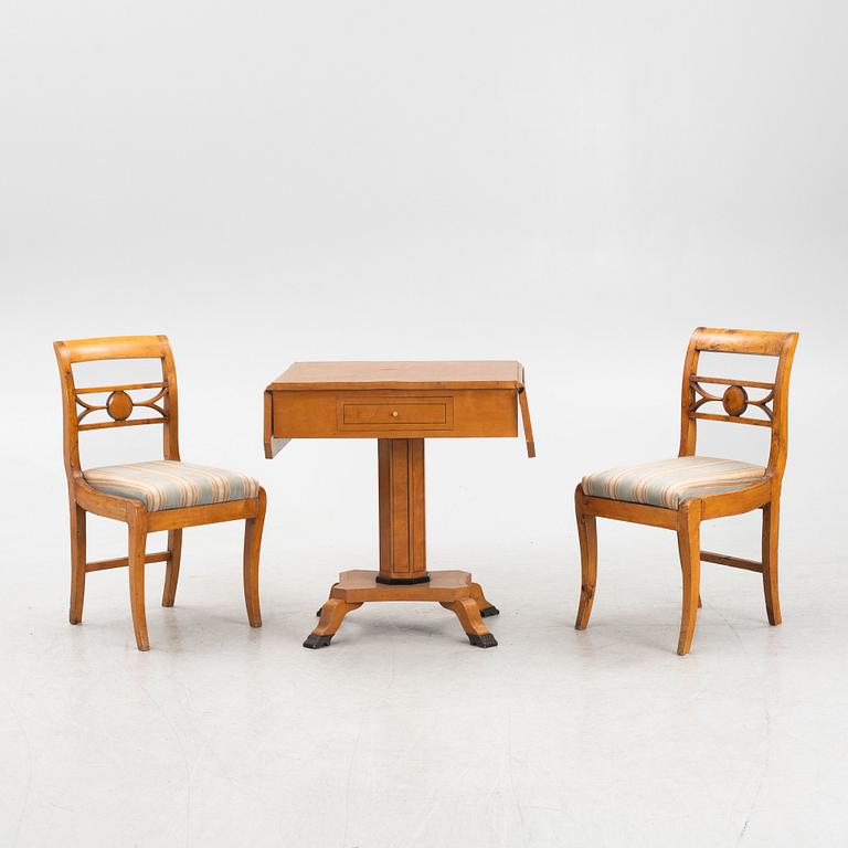 Drop-leaf table and two chairs, Empire style, first half of the 19th century.