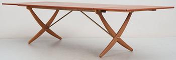 A Hans J Wegner teak and oak sabre leg dinner table by Andreas Tuck, Denmark 1950-60's.