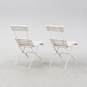 A garden sofa and four chairs, mid 20th Century.