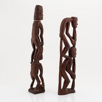 A group of three wooden Asmat sculptures, 20th Century.