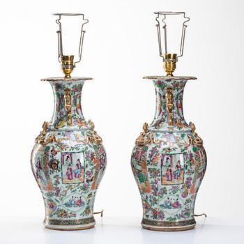 A pair of famille rose Canton vases made in to lamps, Qing dynasty, 19th Century.