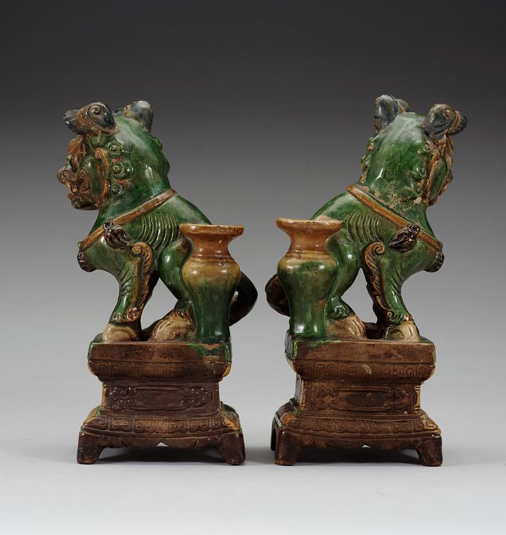 A pair of seated Buddhist lions, 17th Century.