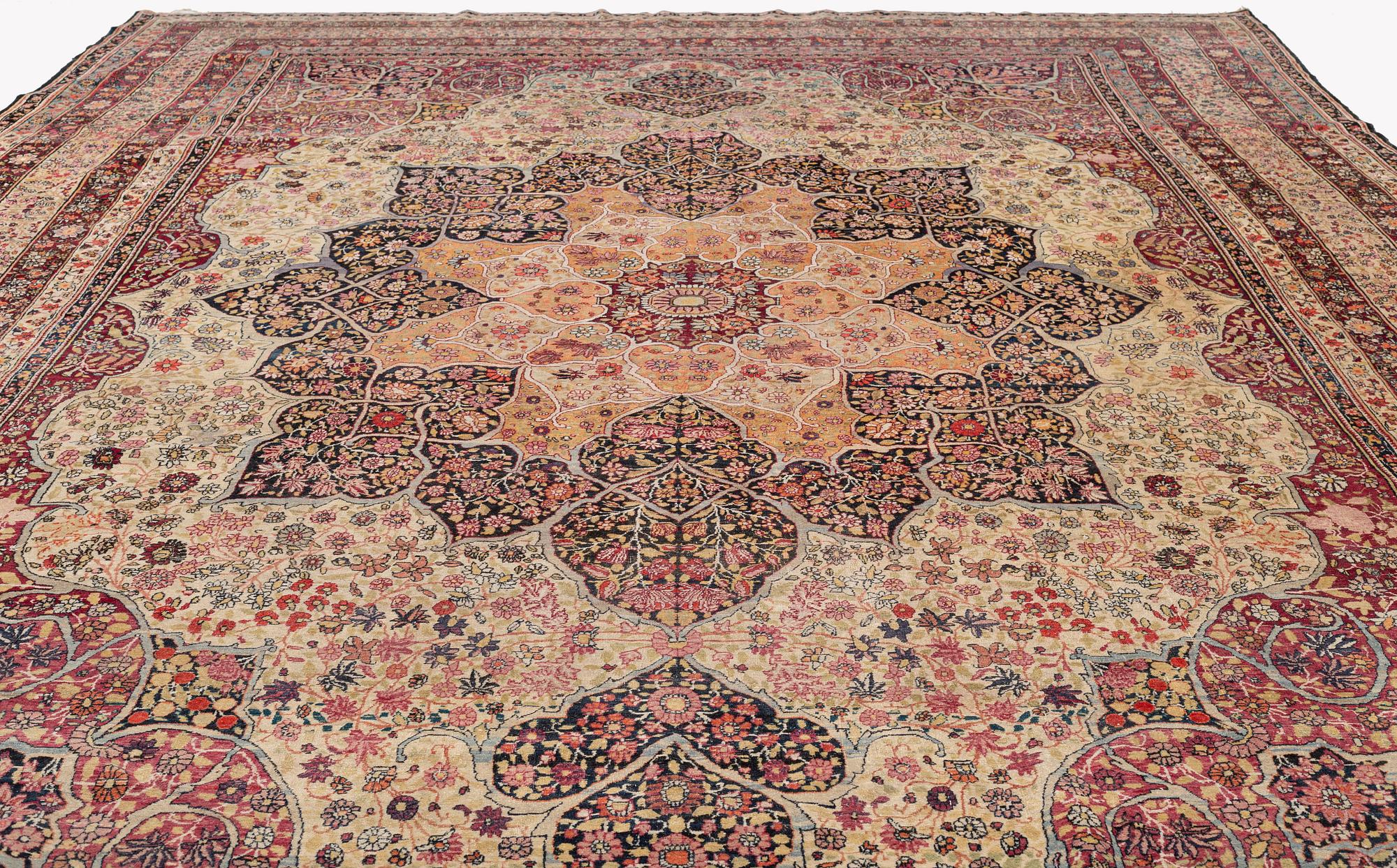An antique Kerman Laver carpet, c. 586 x 385 cm.