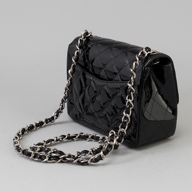 A black lacquer "Classic mini" bag by Chanel 2009-2010.