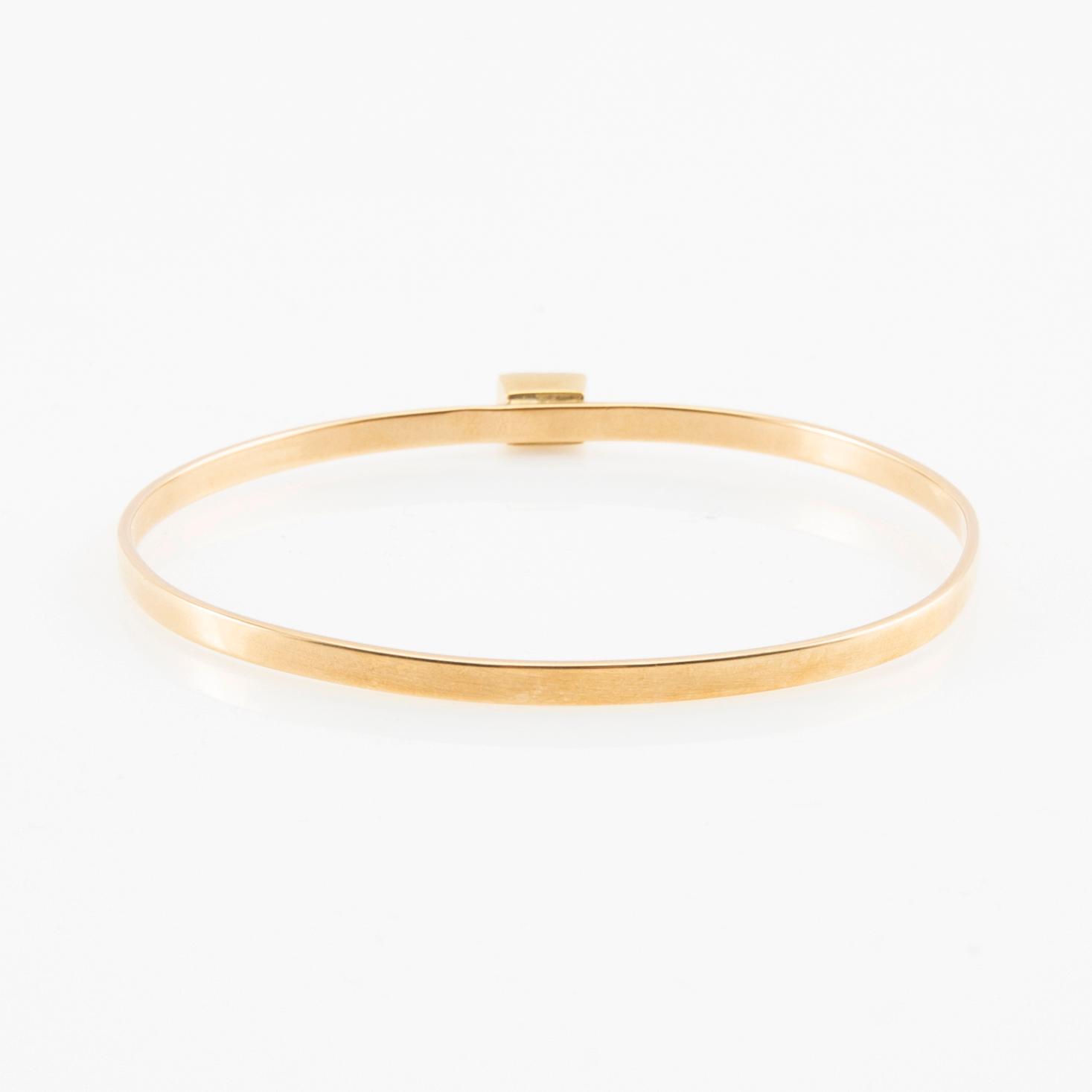 Wiwen Nilsson, Armring 18K gold with a synthetic white spinel, Lund 1967.