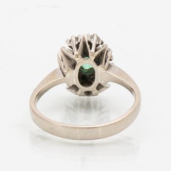 Ring in 18K white gold with an oval faceted green tourmaline and round brilliant-cut diamonds.