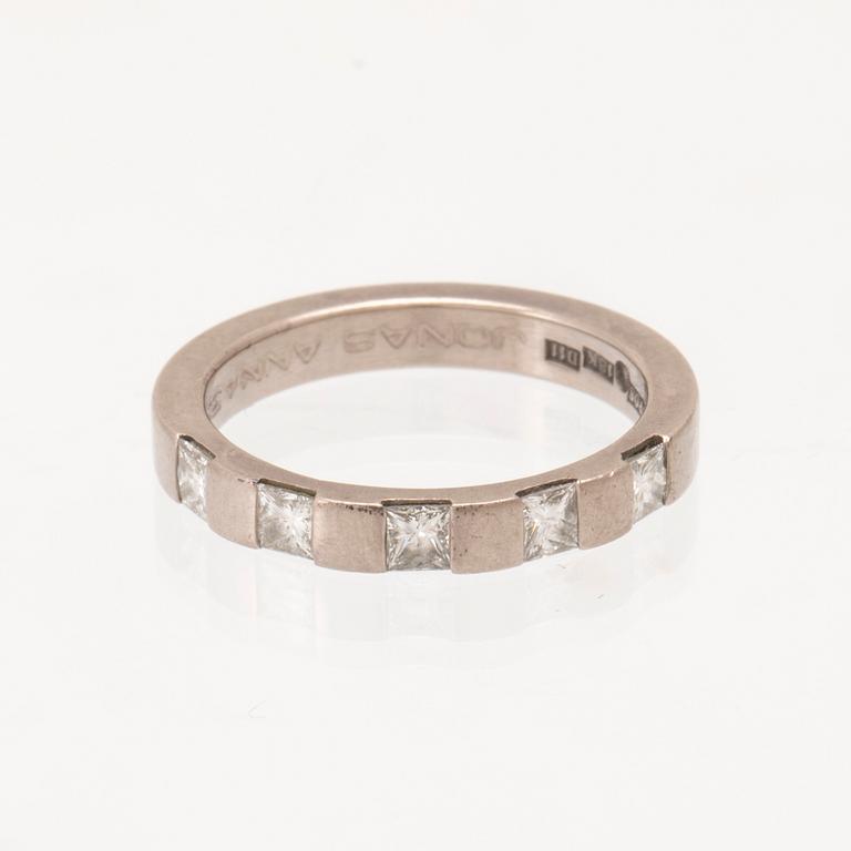 An 18K white gold half-eternity ring set with princess-cut diamonds, Atelje Guld-Bros Stockholm.
