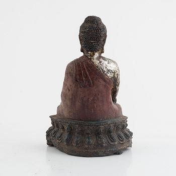 A Chinese cast iron figure of a Buddha, probably late Ming dynasty.