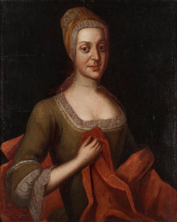 Elegant kvinna med pärlor och spets.