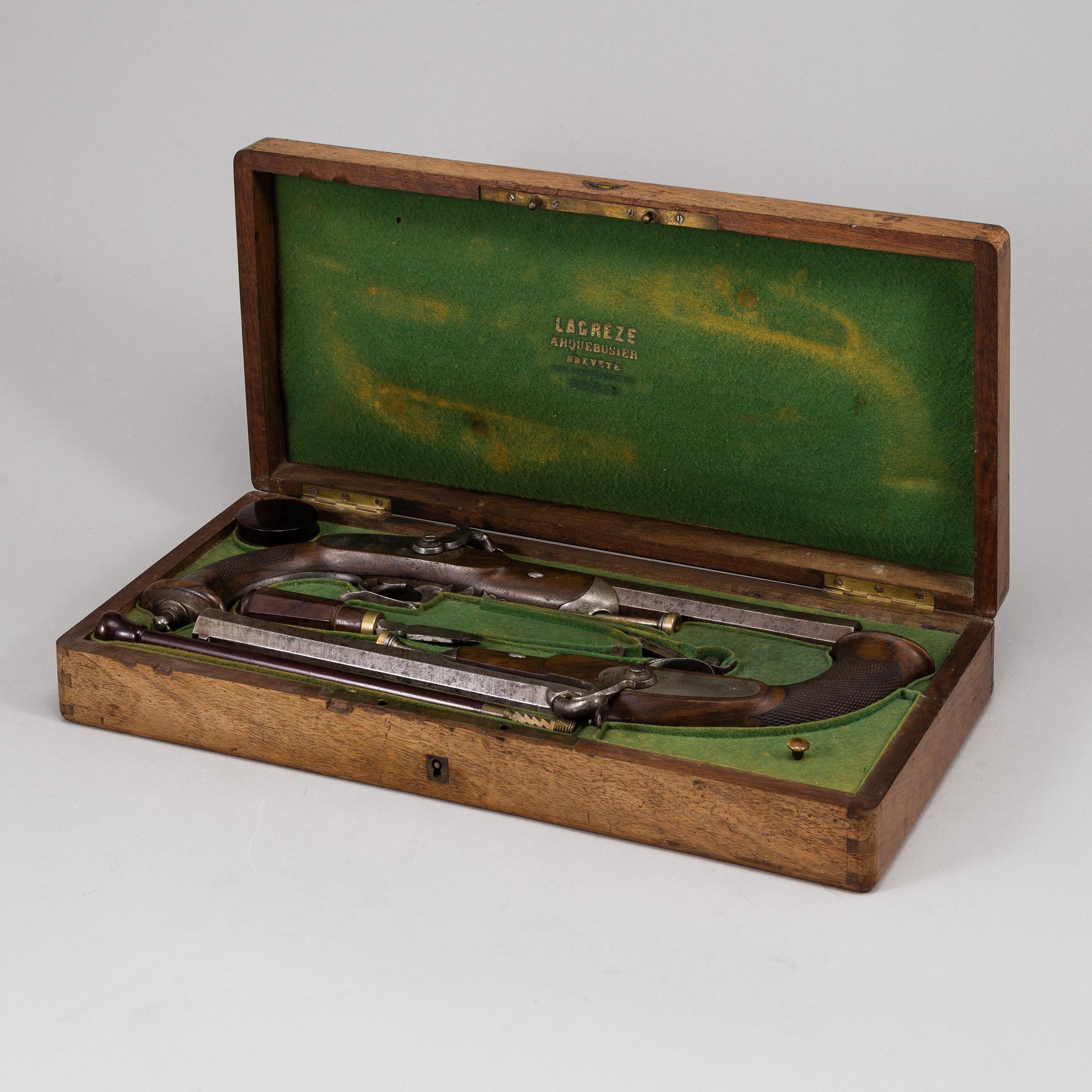 A 1840's French cased percussion pistols marked: Mre Rle de Maubeuge.