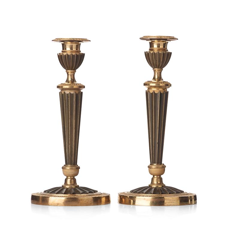 A pair of French Empire early 19th century candlesticks.