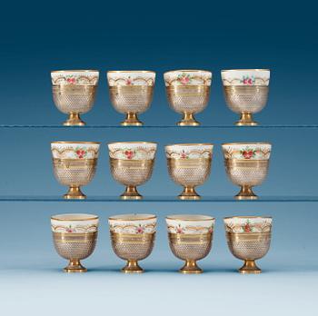 1252. ZARFS, 12 pieces, silver with porcelain cups. Ottoman. Height 4,5 cm, with cups 6,5 cm.