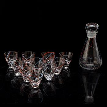 VICKE LINDSTRAND,  a glass decanter and ten glasses, signed, Kosta.