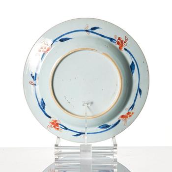 A set of 12 famille rose dinner plates, Qing dynasty, first half of the 18th Century.