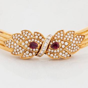 A necklace and a braclet in 18K gold set with faceted rubies.