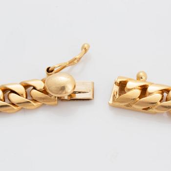 Bulgari "Monete" collier 18K guld med ett romerskt mynt och en baguetteslipad diamant.