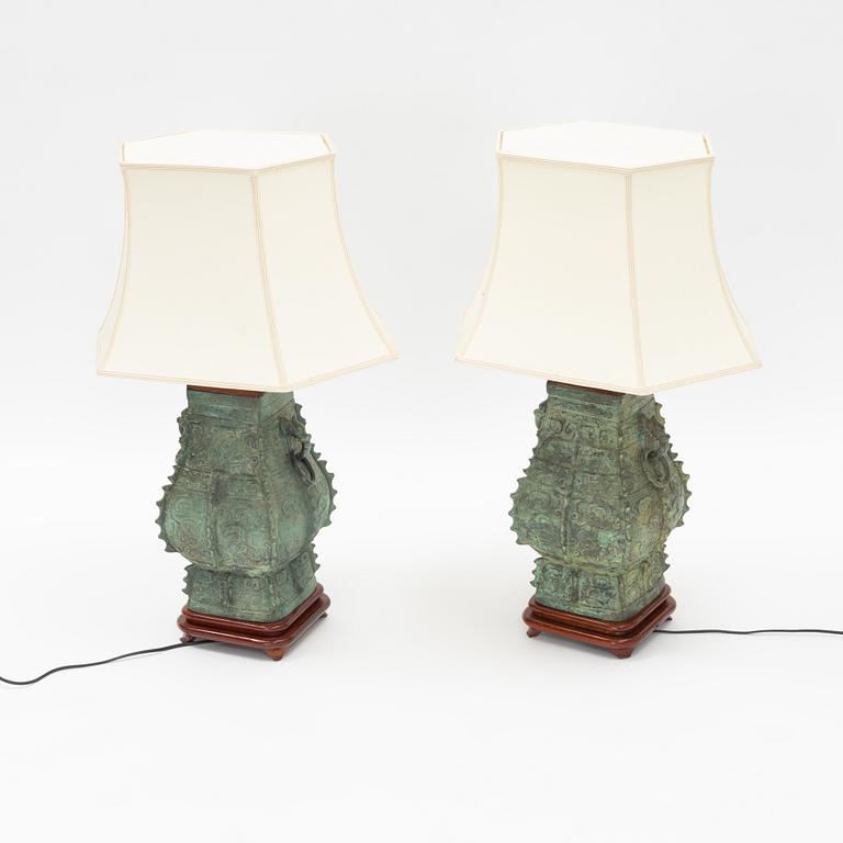 A pair of archaistic bronze vases made in to lamps, China, 20th Century.